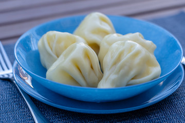 Georgian dumplings Khinkali with meat on plate close-up