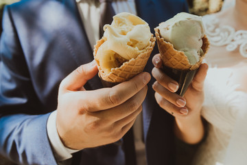 Young couple holding ice cream cones