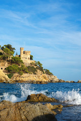 Fototapeta na wymiar Lloret de Mar. September 2018. Spain. View of the fortress on the rock on a Sunny day. Seascape