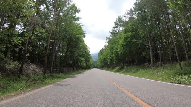 4K POV point of view car driving through highway mountain