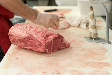 Butcher Carving Meat - 230874923