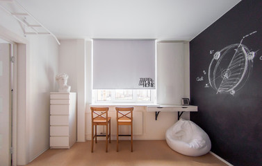 playground room with white and black design and charcoal wall