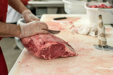Butcher Carving Meat - 230874966