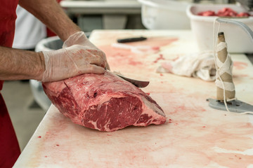 Butcher Carving Meat - 230874990