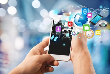 Mobile phone in female hands on a