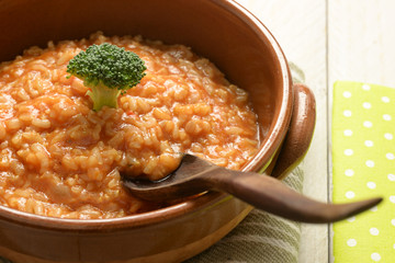 risotto with broccoli on, wooden table
