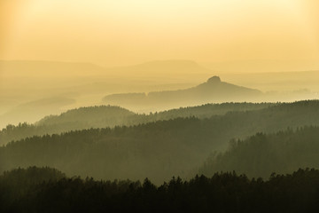 Naklejka na ściany i meble Saxon Switzerland mountains landscape layers in fog, Germany