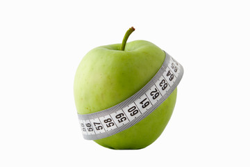 green apple and measuring tape on white background.isolated