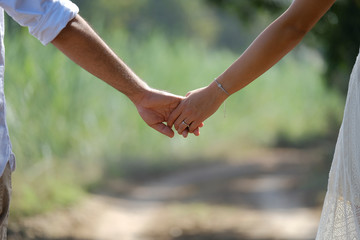 Couples holding hands.Summer in love. Love story.