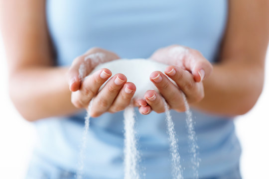 White Sugar In The Woman Hands. Heap Of White Sugar.