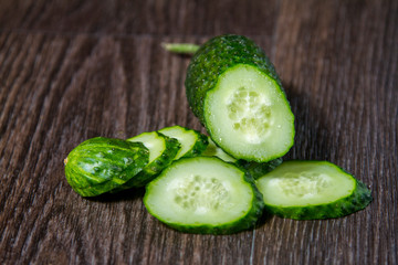 ripe cucumber lies on the table