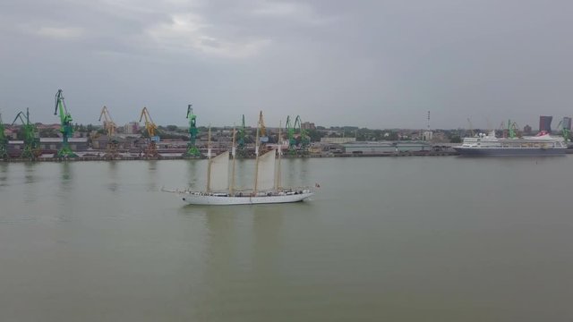 Aerial of Portuguese tall ship "Santa Maria Manuela" leaving port of Klaipeda during Tall Ships Races 2017
