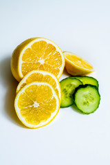 Fototapeta na wymiar ripe cucumber and lemon on white background