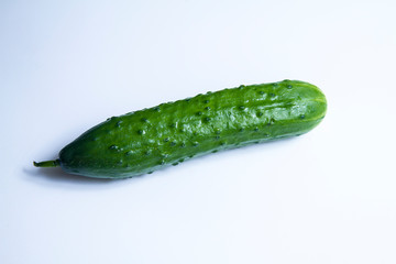 ripe cucumber on white background