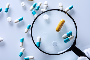 medications under a magnifying glass