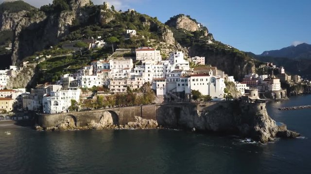 Panning aerial, scenic architecture in Amalfi