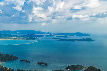 View of blue sky, sea and mountain seen from Cable Car viewpoint, Langkawi, Malaysia. Picturesque landscape with tropical forest, beaches, small Islands in waters of Strait of Malacca