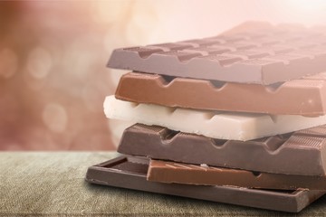 Delicious chocolates isolated on  background