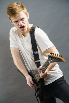 Man playing on electric guitar