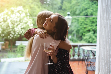 Obraz premium Two girls on the terrace