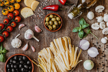 Stylish composition of fresh, italian ingredients and food on the vintage wooden table. Culinary backgrounds. Top view.
