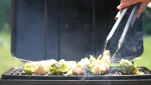 Grilling Caesar salad ingredients, close up