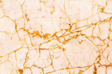 Natural marble texture background. Stone texture in warm colors. Lines and waves. Background with small waves and a round pattern. Orange, gold, yellow and beige shades.
