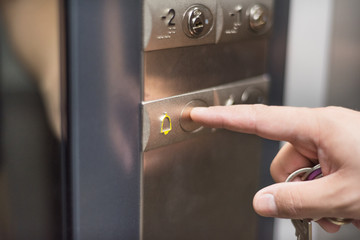 Pressing the alarm button in the elevator