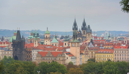 Fototapeta na wymiar Old town of Prague. Czech Republic over river Vltava with cathedral and Charles bridge on skyline. Bright sunny day blue sky. Praha panorama landscape view