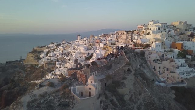 Sunset over Greek island town, aerial