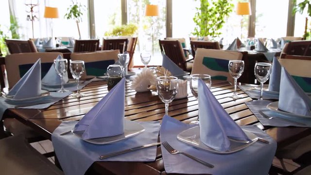 a decorated dinner table. Scene. Beautiful table decoration in the restaurant in the summer. Restaurant interior