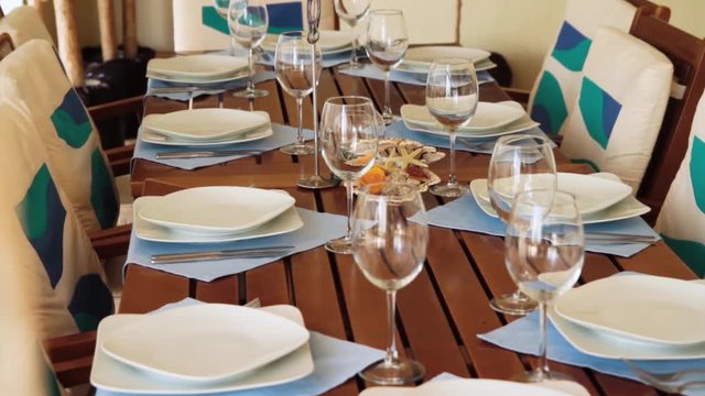 a decorated dinner table. Scene. Beautiful table decoration in the restaurant in the summer. Restaurant interior