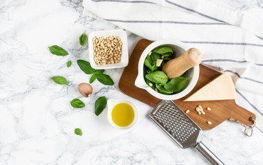 Homemade Classic Green Pesto Sauce in While Bowl with Pine Nuts Parmesan Cheese Garlic Olive Oil Italy Healthy Food Concept