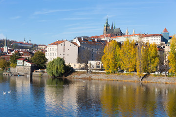 Fototapeta premium Colorful autumn Prague gothic Castle with the Lesser Town above River Vltava in the sunny Day, Czech Republic