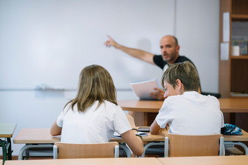 Couple young students studying at school