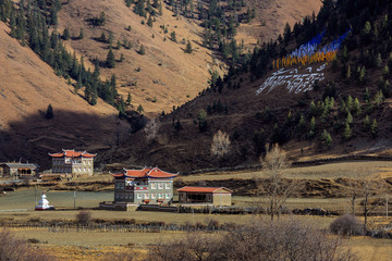 Tibetan houses near the town of Xinduqiao - Ganzi Tibetan Autonomous Prefecture, Sichuan Province China. Chinese landscape, traditional architecture, Tibetan plateau. High altitude landscape, stupa