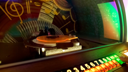 Retro music box, bar customer choosing favorite melody, entertainment nostalgia