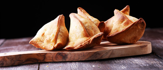 Vegetarian samsa or samosas.Indian special traditional street food punjabi samosa or Coxinha,...