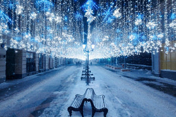Night winter Moscow in the snow. Nikolskaya street decorated for the New year.