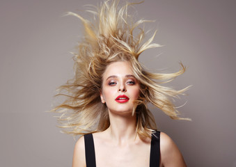  beauty portrait of attractive young caucasian woman blond on beije background studio shot hair...
