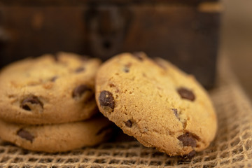 Cookies tied with a gray jute string into a bow. Cookies of sweets on a wooden kitchen table.
