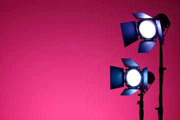 Equipment for photo studios and fashion photography. Pink background and reflector. Ready to shoot photo scheme concept.