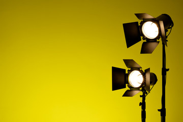 Equipment for photo studios and fashion photography. Yellow background and reflector. Ready to shoot photo scheme concept. - obrazy, fototapety, plakaty