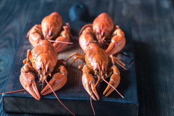 Boiled crayfish on the wooden board