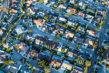 Late afternoon aerial view of modern suburban cul-de-sac streets and homes near Los Angeles in Simi...