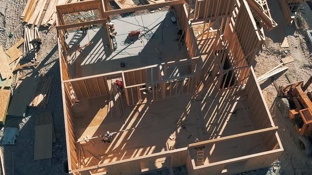 New House Being Built, Drone View Of Builders Working To Frame Construction.