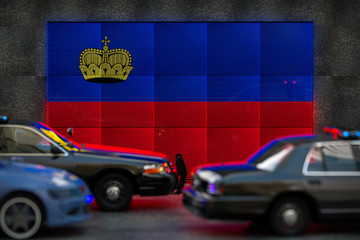 Bright digital display Liechtenstein flag in city as cars drive past