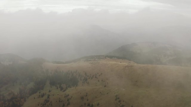 Flying from white cloud over autumn mountain transition from white, Aerial shot, Slovakia