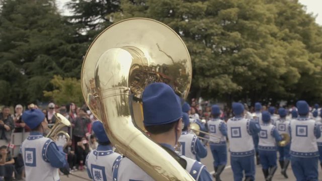 Close up of golden Bass horn music instrument with reflections on parade at Canada day