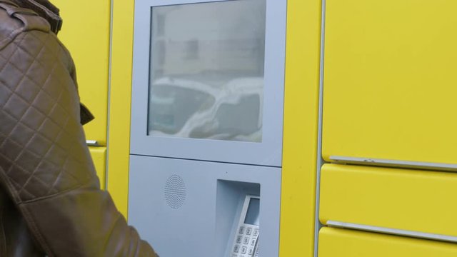 entering something on a touch pad of a parcel station